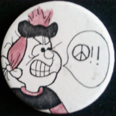 Rusted 1982 CND Badge